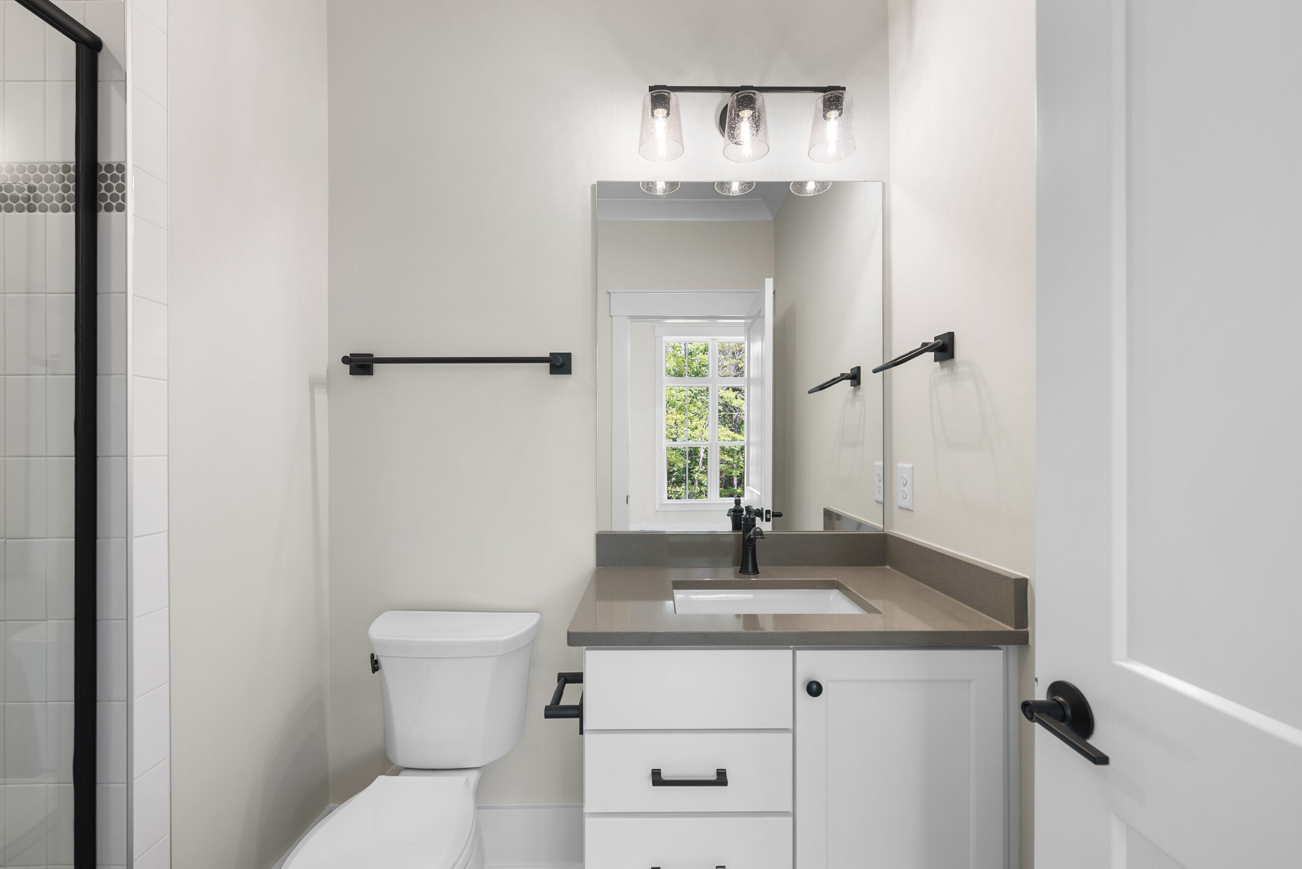 Family bathroom design with double vanity and durable finishes<br />
