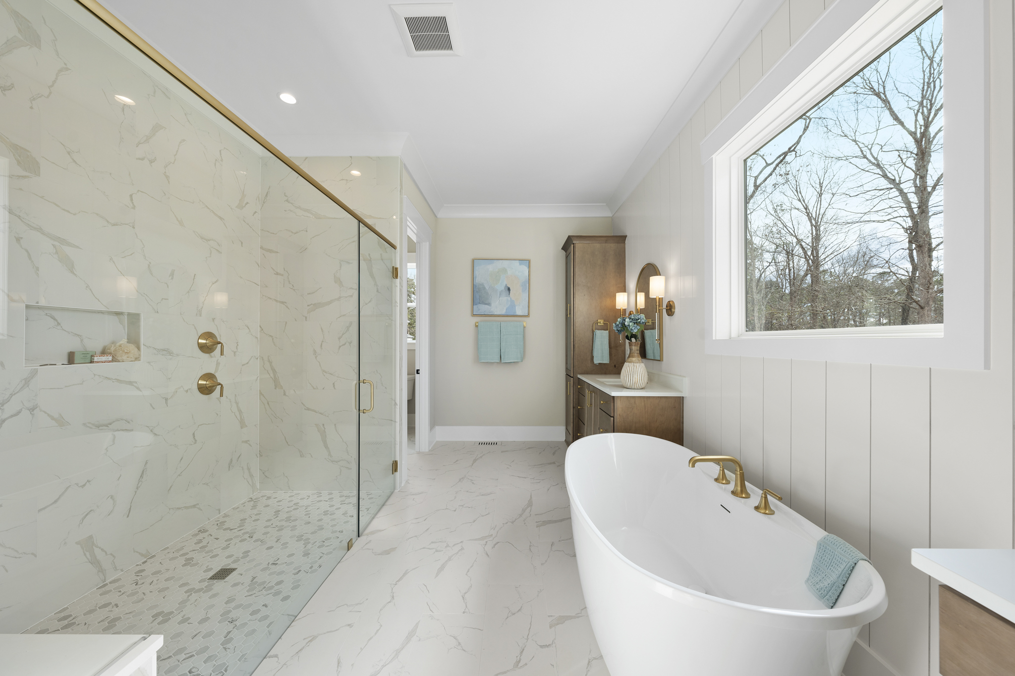 Modern powder room design with statement wallpaper and brass fixtures